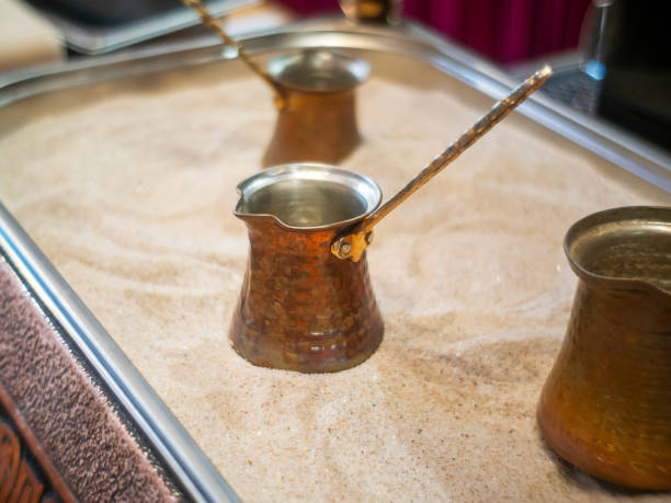 istock Retro coffee grinder on  hot sand 2205188372