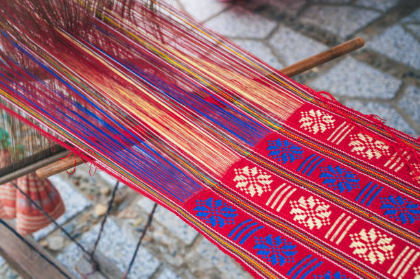 weaving and making handmade fabrics. close-up of a loom