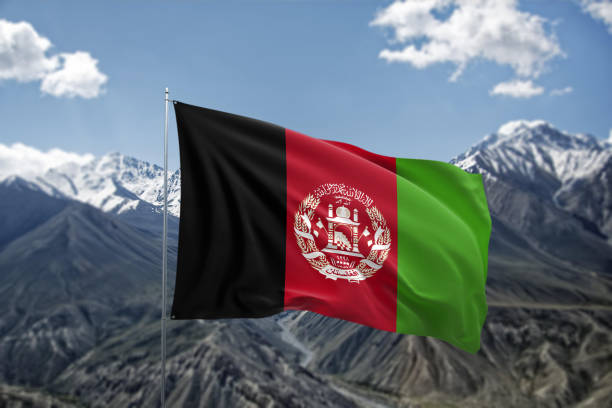 istock Afghan Flag Against Majestic Mountain Range Under Clear Sky 2205190054