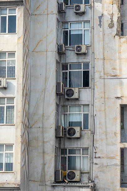 istock Urban Building with Air Conditioning Units Displayed on Facade 2205190400