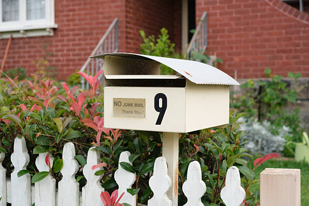 istock Old cream colored metal mailbox with no junk mail sign 2205191009