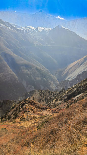 istock Sunny haze over a mountain gorge. 2205191691