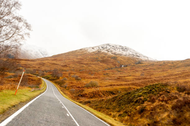 istock A Scottish Highland Road Taking Vehicles Through The Most Stunning Scenery 2205193367