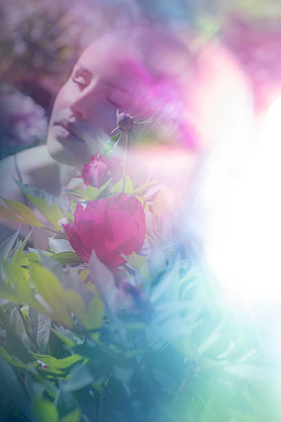 istock Blurred Woman Face behind a Vibrant Peony 2205199366