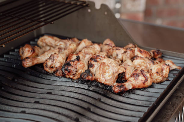 istock Close-up of grilled chicken thighs on a grill 2205201862