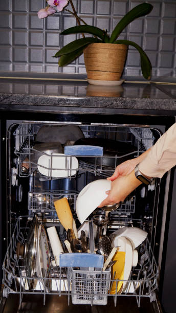 istock young woman and open dishwasher 2205202726