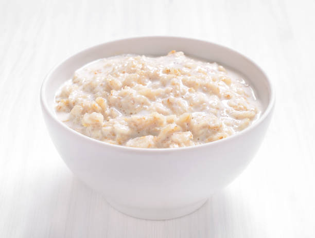 istock Oatmeal porridge in white bowl. 2205206547