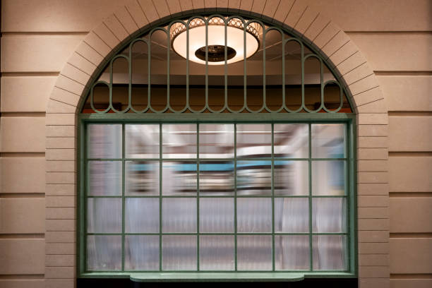 Illuminated Restaurant By Building At Dusk