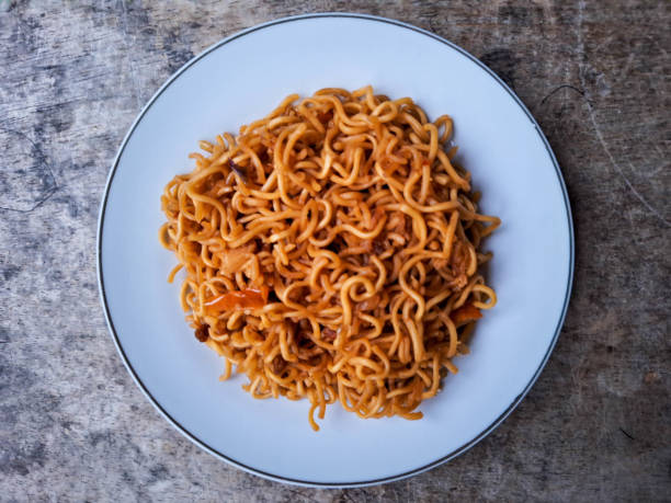 istock Mi Goreng Or Fried Noodle On A Plate. Food Menu. Top View. 2205207139