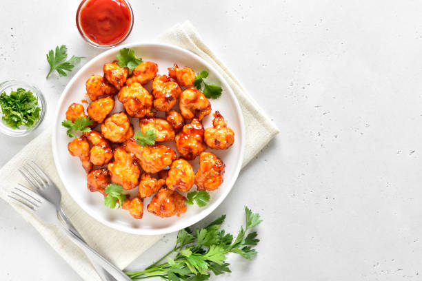 istock Sweet chili cauliflower wings on white plate 2205208733