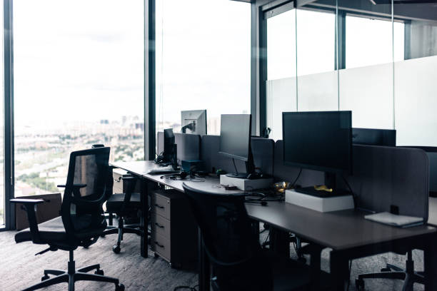istock Modern empty office room with glass windows and mesh chairs 2205209319