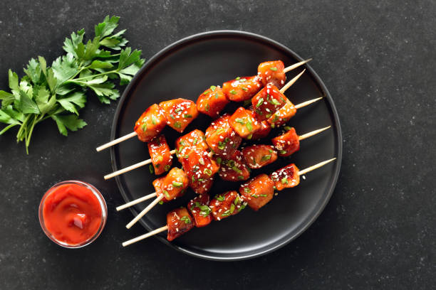 istock Teriyaki chicken skewers on plate 2205210097