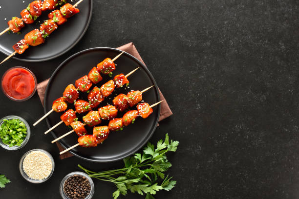 istock Teriyaki chicken skewers on plate 2205210104