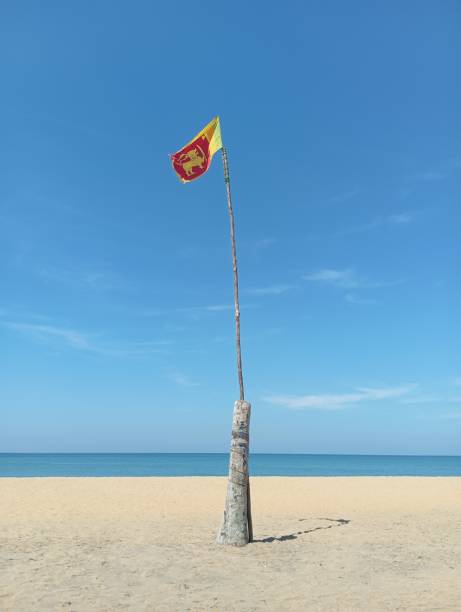 istock Flag of Sri Lanka on beach 2205214031