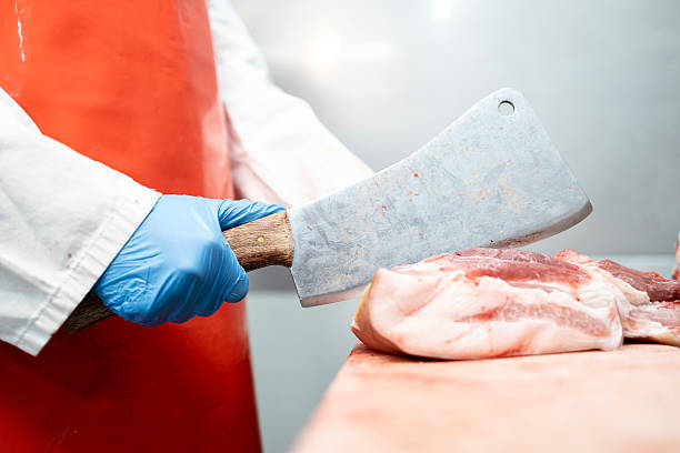 istock Cutting meat in butchery shop. 2205215300