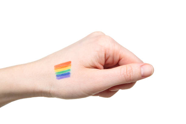 istock Female hand with drawing rainbow flag and on white background 2205216578