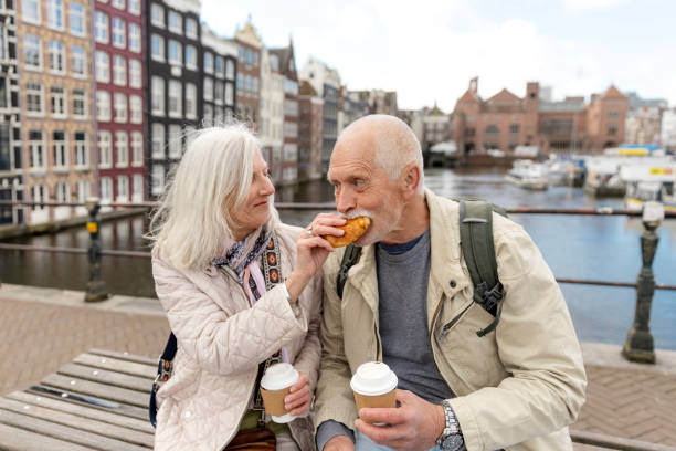 istock Senior citizens travelling in Amsterdam 2205220394