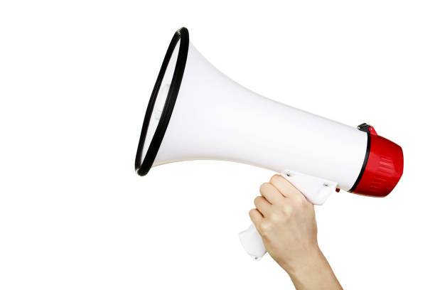 istock Female hand holding megaphone on white background 2205220408