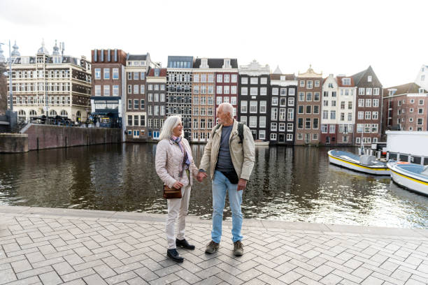 istock Senior citizens travelling in Amsterdam 2205220445