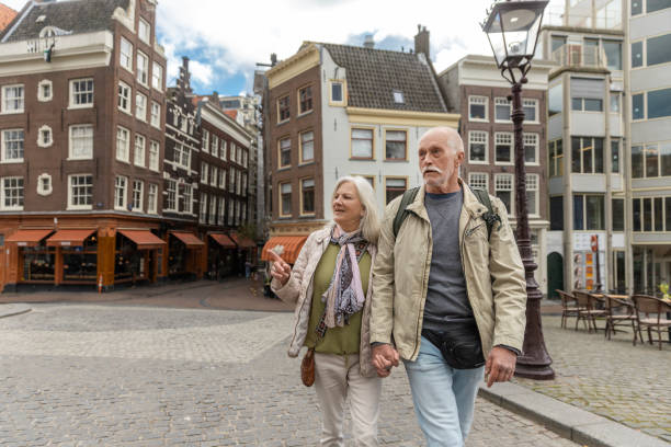 istock Senior citizens travelling in Amsterdam 2205220702