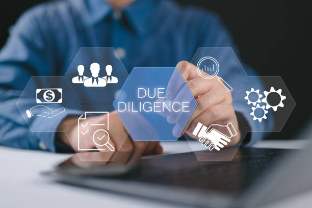 istock Due diligence concept. Businessman using laptop with due diligence icon on virtual screen. 2205224333