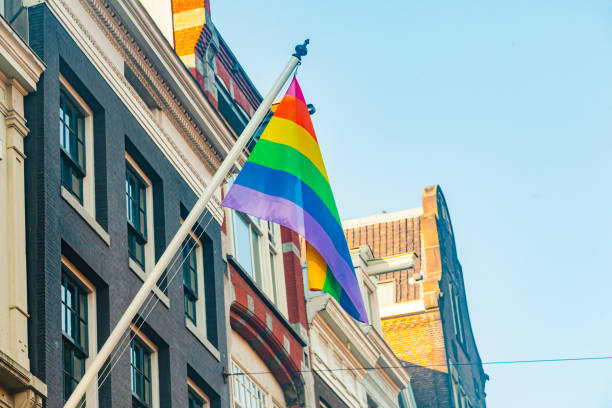 istock Rainbow LGBT flag on an ancient building in the old town. 2205225332