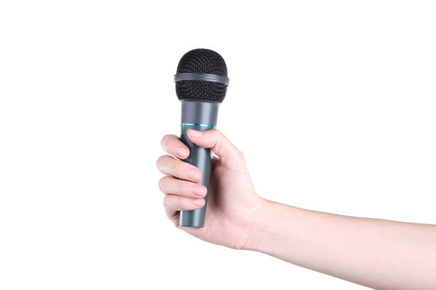 istock Female hand holding microphone on white background 2205225617