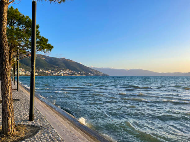 istock Tranquil seaview framed by distant mountains and gentle ripples 2205226020