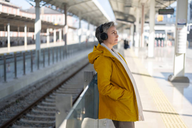 istock A woman at the train station 2205227015