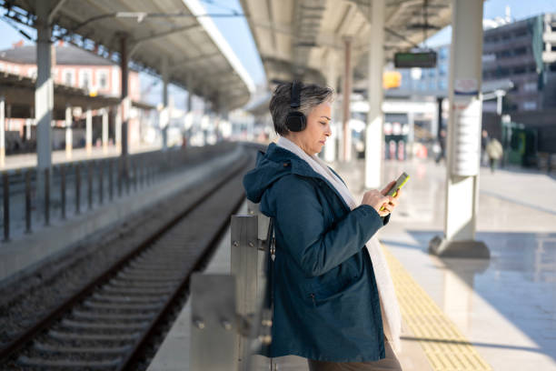 istock A woman at the train station 2205227017