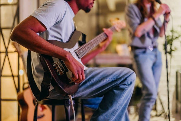 istock Talented bass guitarist playing his instrument 2205227073