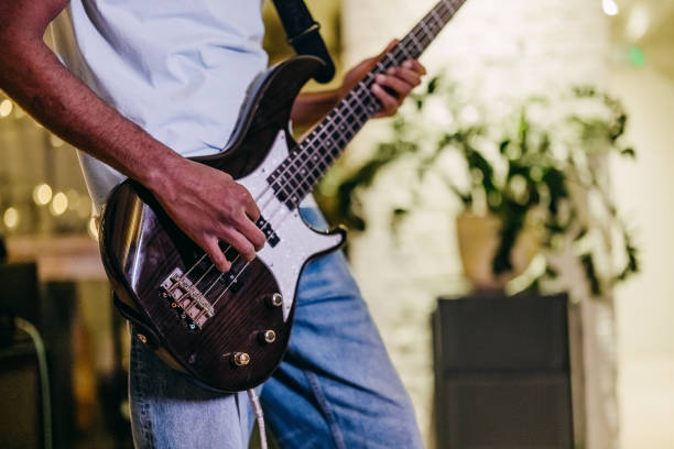 Electric guitar on the floor in blue lighting close up