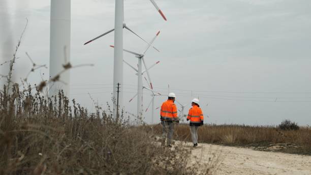 istock Engineers Team Working in Wind Farm. Sustainable Energy 2205228177