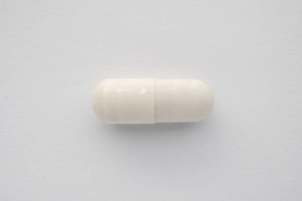 istock White medicine pill capsule on white background 2205228382