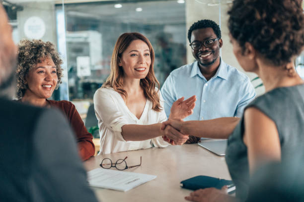 istock Shaking hands with new colleague 2205228643