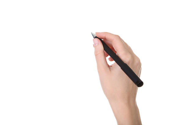 istock Female hand holding pen on white background 2205228705