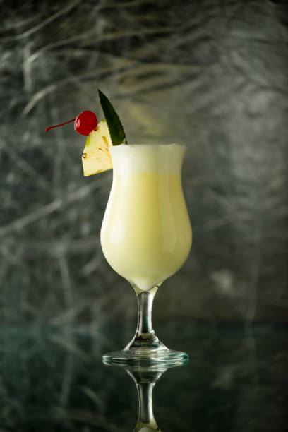istock Delicious and refreshing Pina Colada cocktail with a cherry and pineapple slice 2205230160