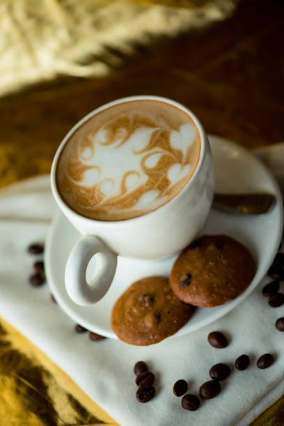 istock Delicious Coffee with Latte Art and Chocolate Chip Cookies 2 2205230227