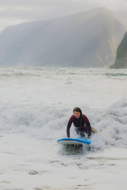 istock Active Woman Surfing in the Ocean 2205231935