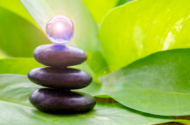 Blue shining glass marble on top zen stones with customizable space for text.