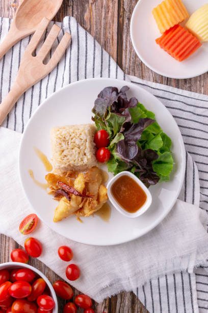 istock Rice with Crispy Fried Fish and Tamarind Sauce 2205237928