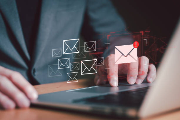 istock Business man using smartphone and computer that show warning sign after got attack phishing email by malware from hacker that commit cyber crime or software crash to cause an error. 2205241278