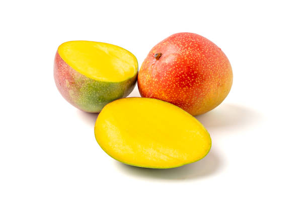 istock A yellow and red mango is cut in half 2205243443
