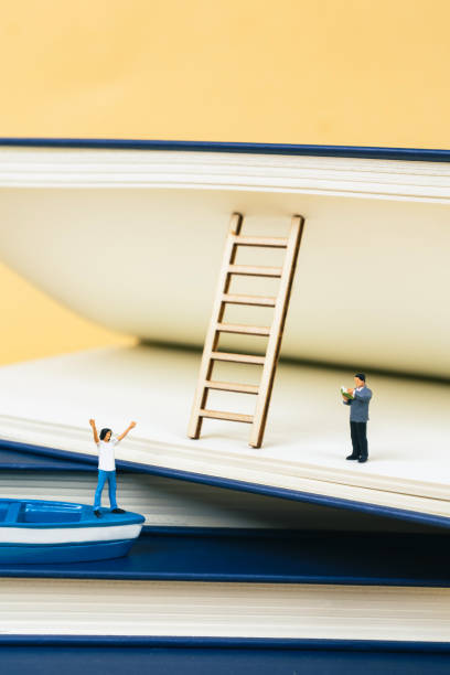 istock Young people learn through books - miniature landscapes 2205243755