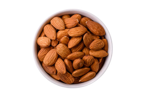 istock Roasted or raw peeled almonds in bowl 2205244699