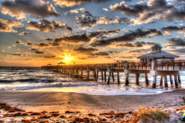 istock Juno Beach Fishing Pier Boardwalk at Sunrise, Jupiter, Juno Florida. 2205247676