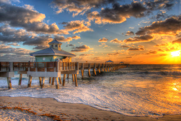 istock Juno Beach Fishing Pier Boardwalk at Sunrise, Jupiter, Juno Florida. 2205247805