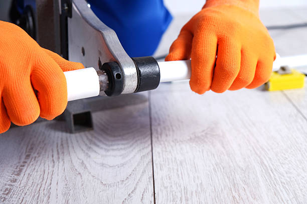 istock Welding of polypropylene pipes, hands of the master close-up 2205247942