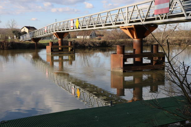 istock Chemilly - Footbridge over the Saone river 2205254925