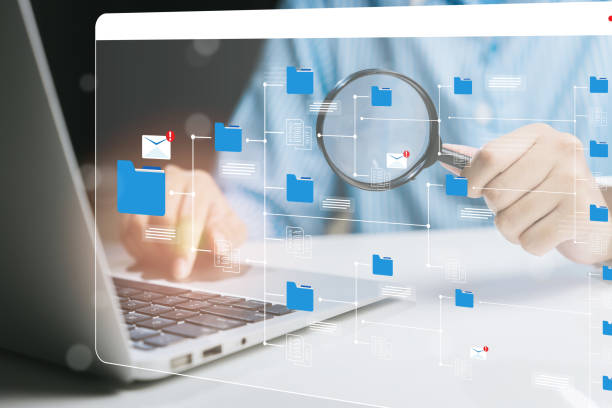 istock Digital Document Management with Magnifying Glass and Laptop for Enhanced Organization, Business concept 2205259295